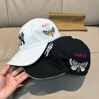 Gucci cap set: white cap and black cap with embroidered butterfly and NY logos