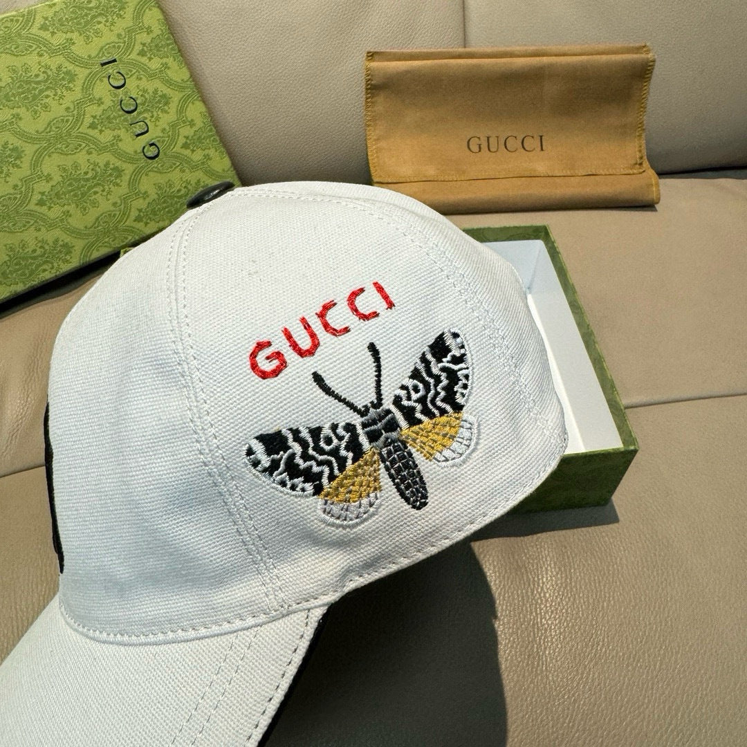 Gucci cap in white canvas with GUCCI red logo and butterfly embroidery on back