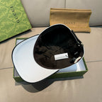 Gucci cap with black interior lining, shown open on a box