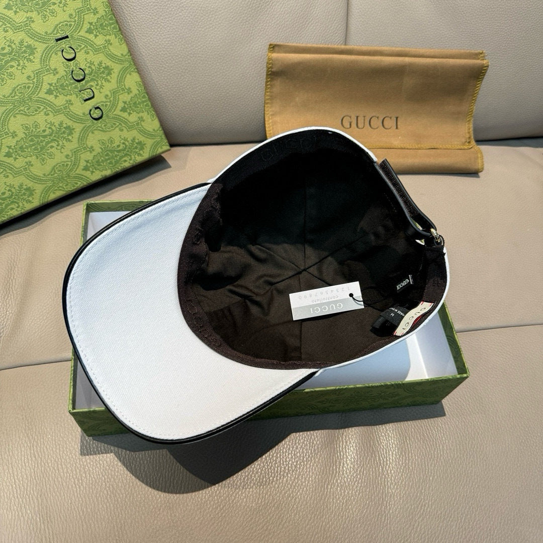 Gucci cap with black interior lining, shown open on a box
