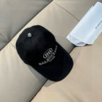 Black baseball cap with front logo patch and curved brim