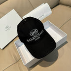 Black baseball cap with embroidered BALENCIAGA MODE logo on front