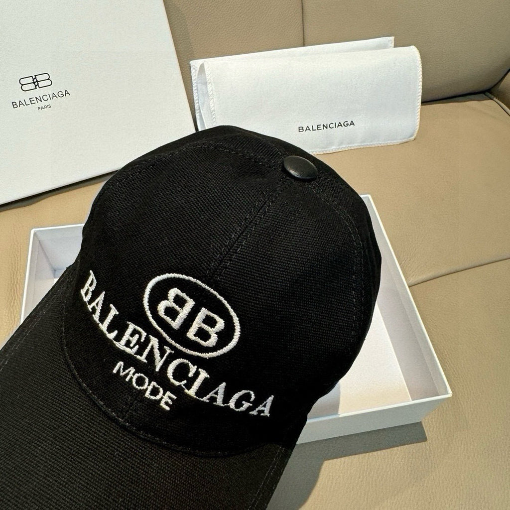Black baseball cap with large central BALENCIAGA MODE logo embroidery
