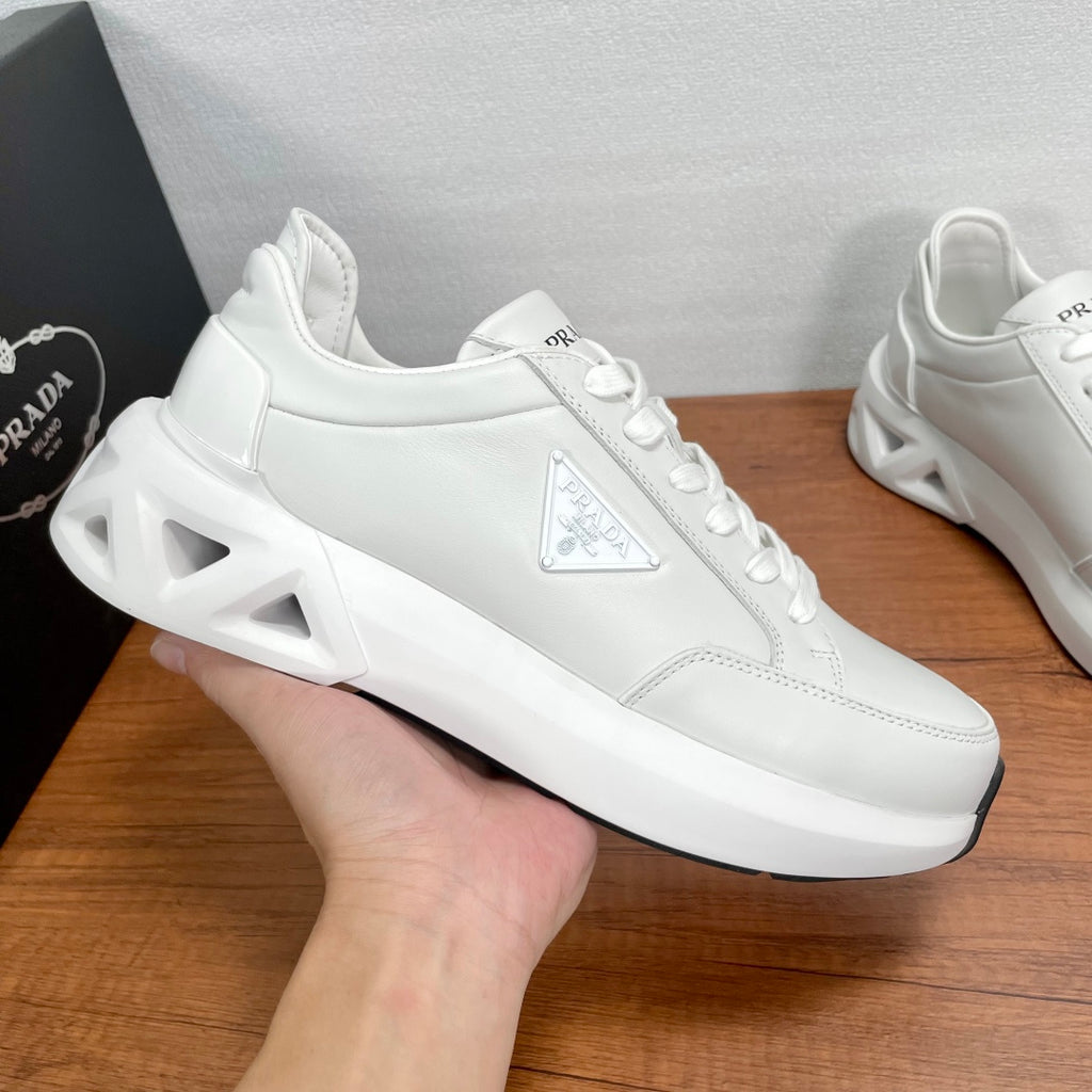 Prada unisex sneakers, white leather with triangular logo panel and lace-up eyelets