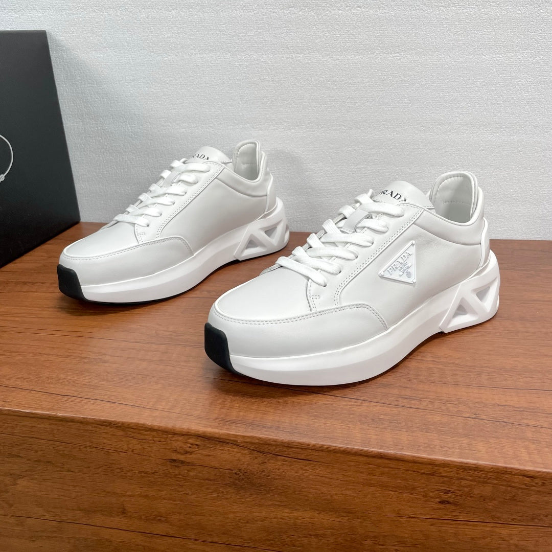 Prada unisex sneakers, white leather with chunky molded sole and lace-up design