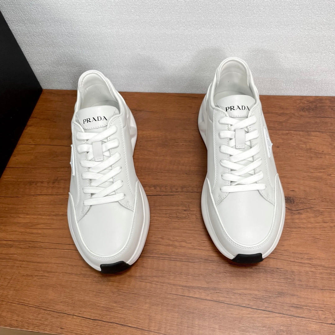 Prada unisex sneakers, white upper with PRADA side label and lace-up closure