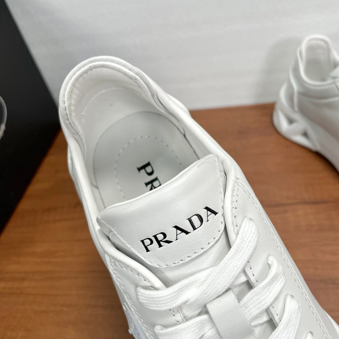 Prada unisex sneakers, white lace-up with PRADA logo on tongue lining