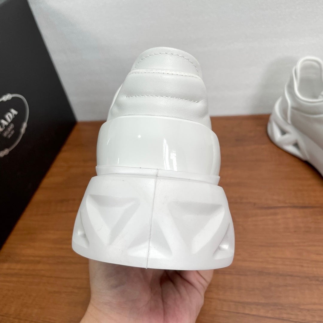 Prada unisex sneakers, white rear view with molded heel and chunky sole
