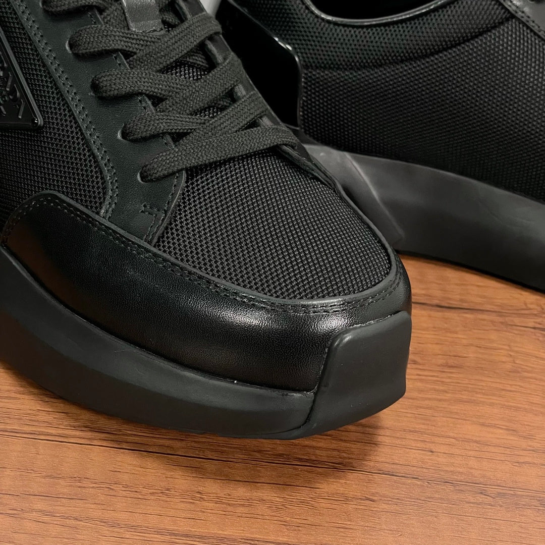 Prada unisex sneaker close-up of laces, textured fabric, and rubber toe cap