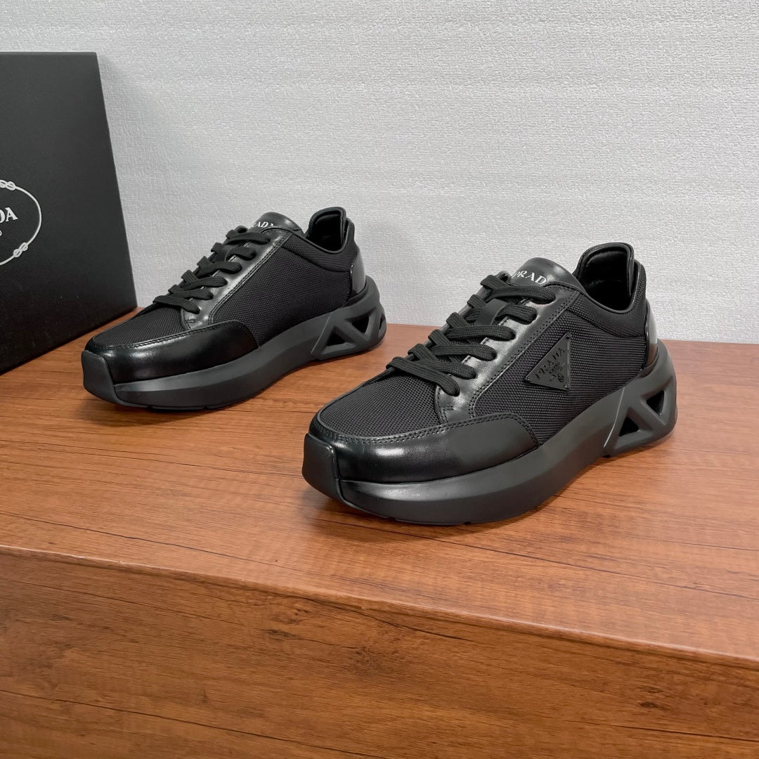 Prada unisex sneakers in black with lace-up front and padded collar