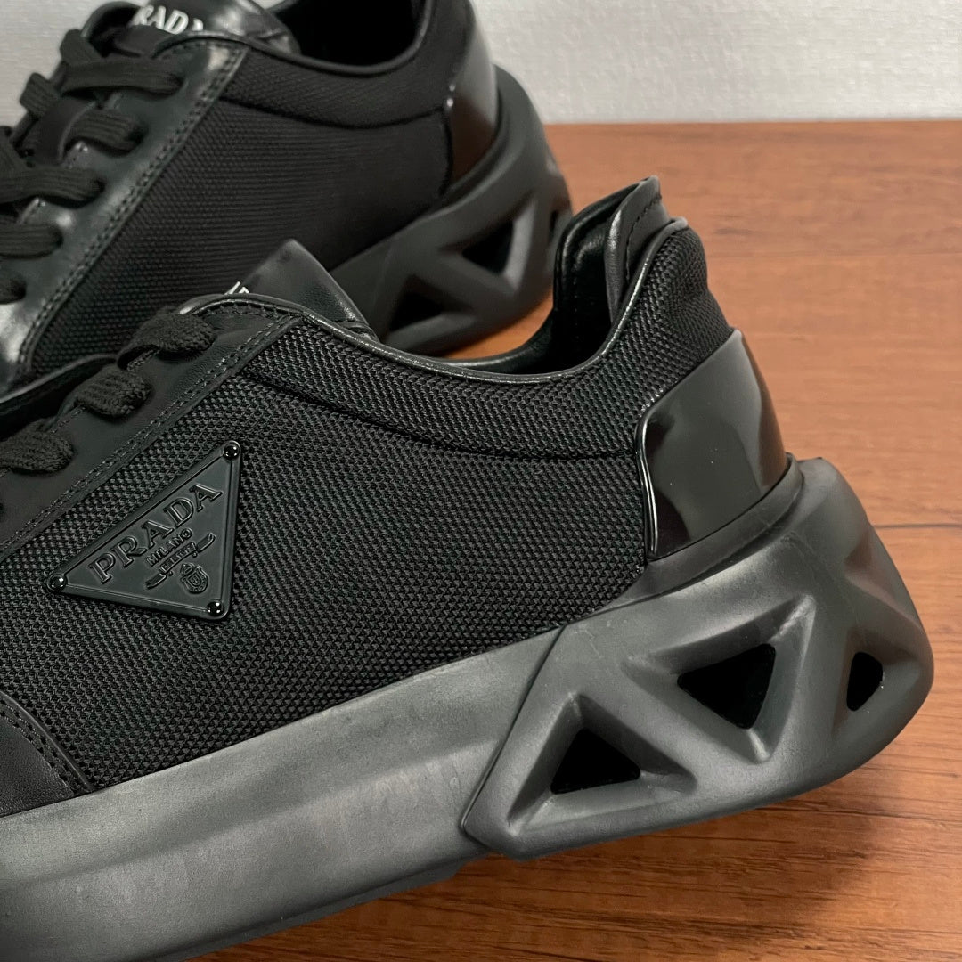 Prada unisex sneaker close-up of textured upper and chunky rubber sole