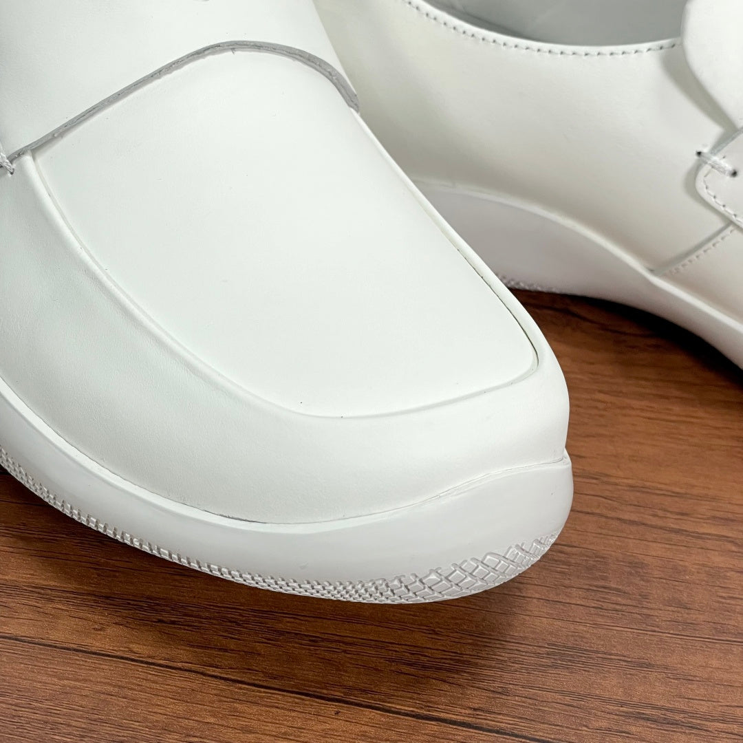 White Prada unisex loafer front with textured midsole edge