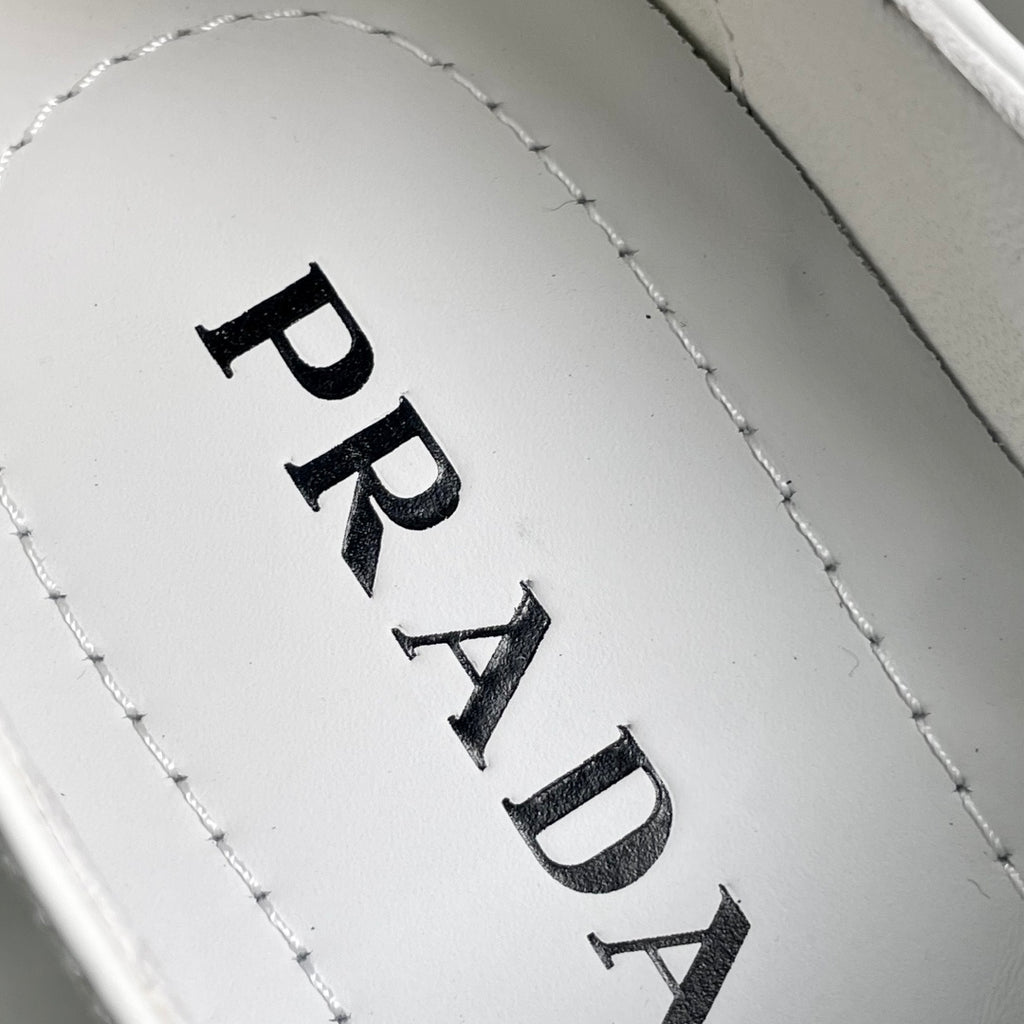 White insole with black PRADA lettering