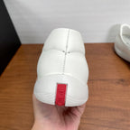 White Prada unisex loafer heel with red PRADA label