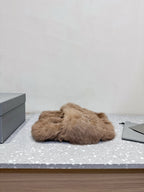 Taupe faux-fur slide sandals with rhinestone bow detail on the upper