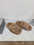Taupe faux-fur sandals with rhinestone bow straps, angled side view