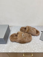 Taupe faux-fur slide sandals with rhinestone bow embellishment and open toe