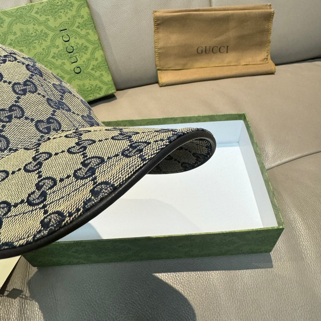 Blue Gucci GG cap showing curved brim with dark underside