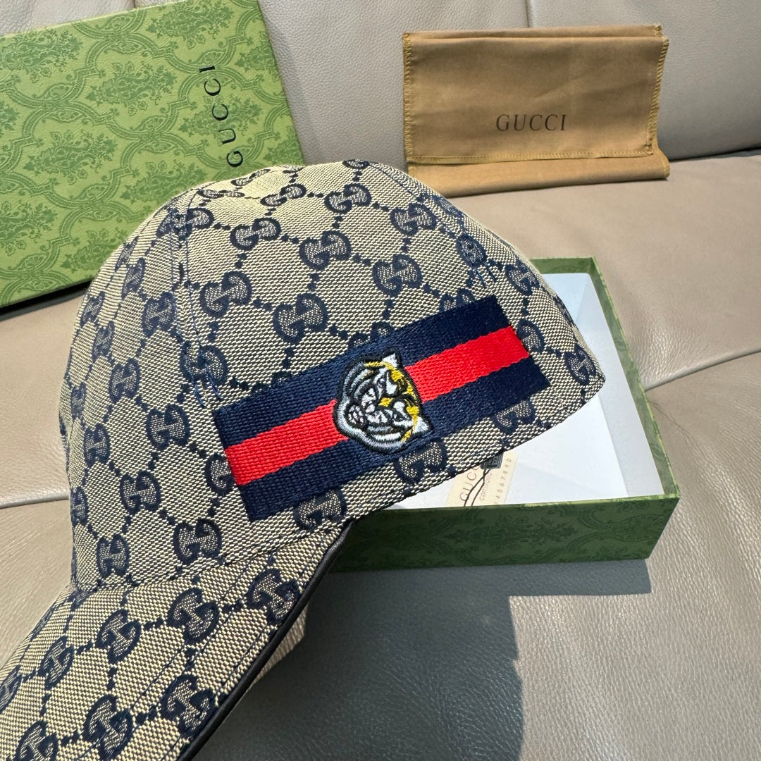 Gucci GG monogram baseball cap in blue with striped band and bee emblem