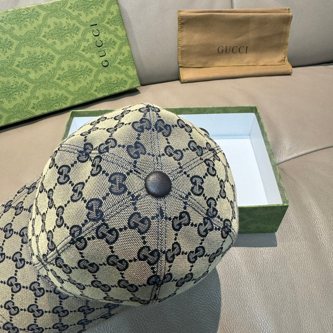 Blue Gucci GG baseball cap with top button and allover monogram pattern