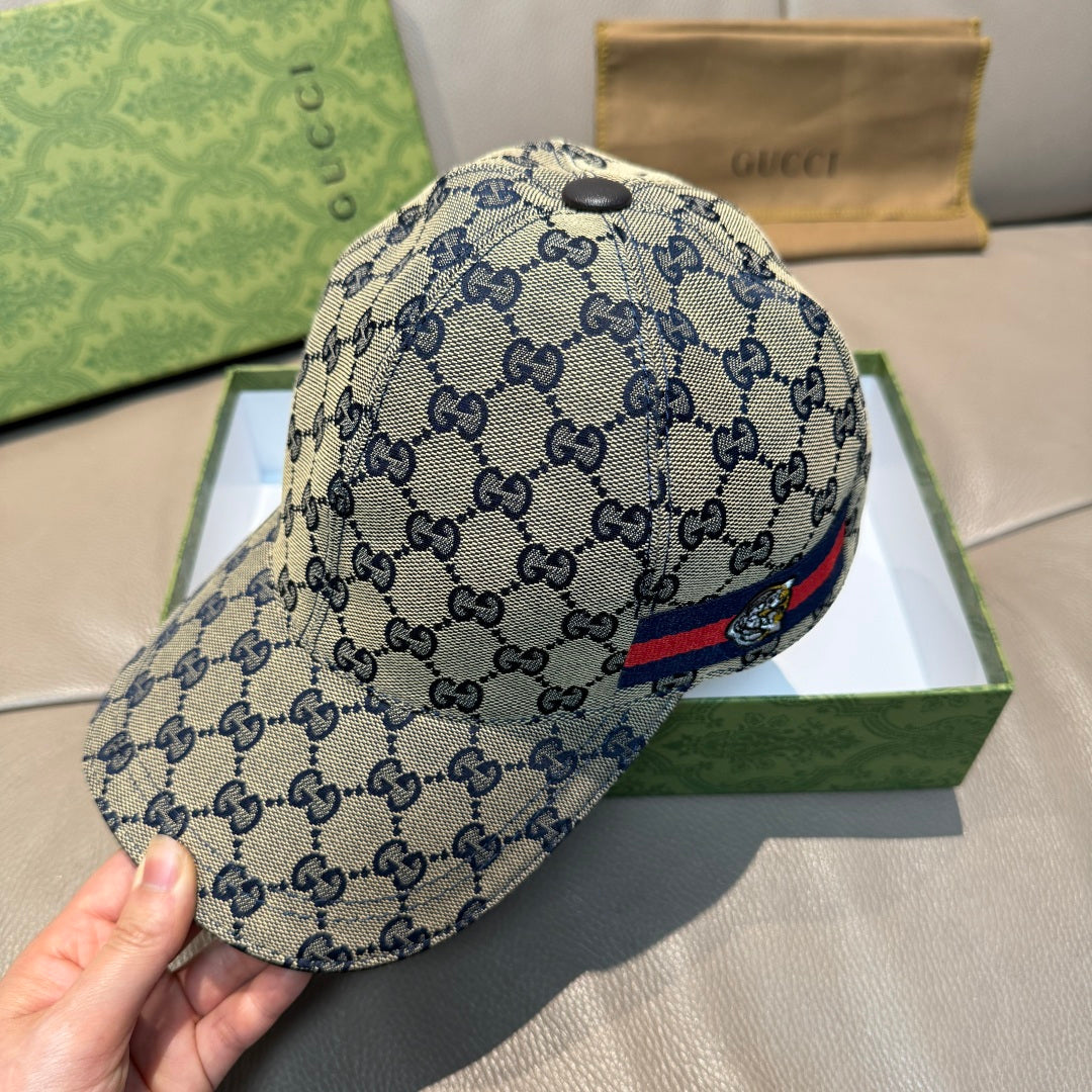 Gucci GG monogram cap in blue with striped front logo patch and curved brim