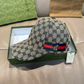 Gucci GG monogram baseball cap in blue with red-and-blue stripe logo patch