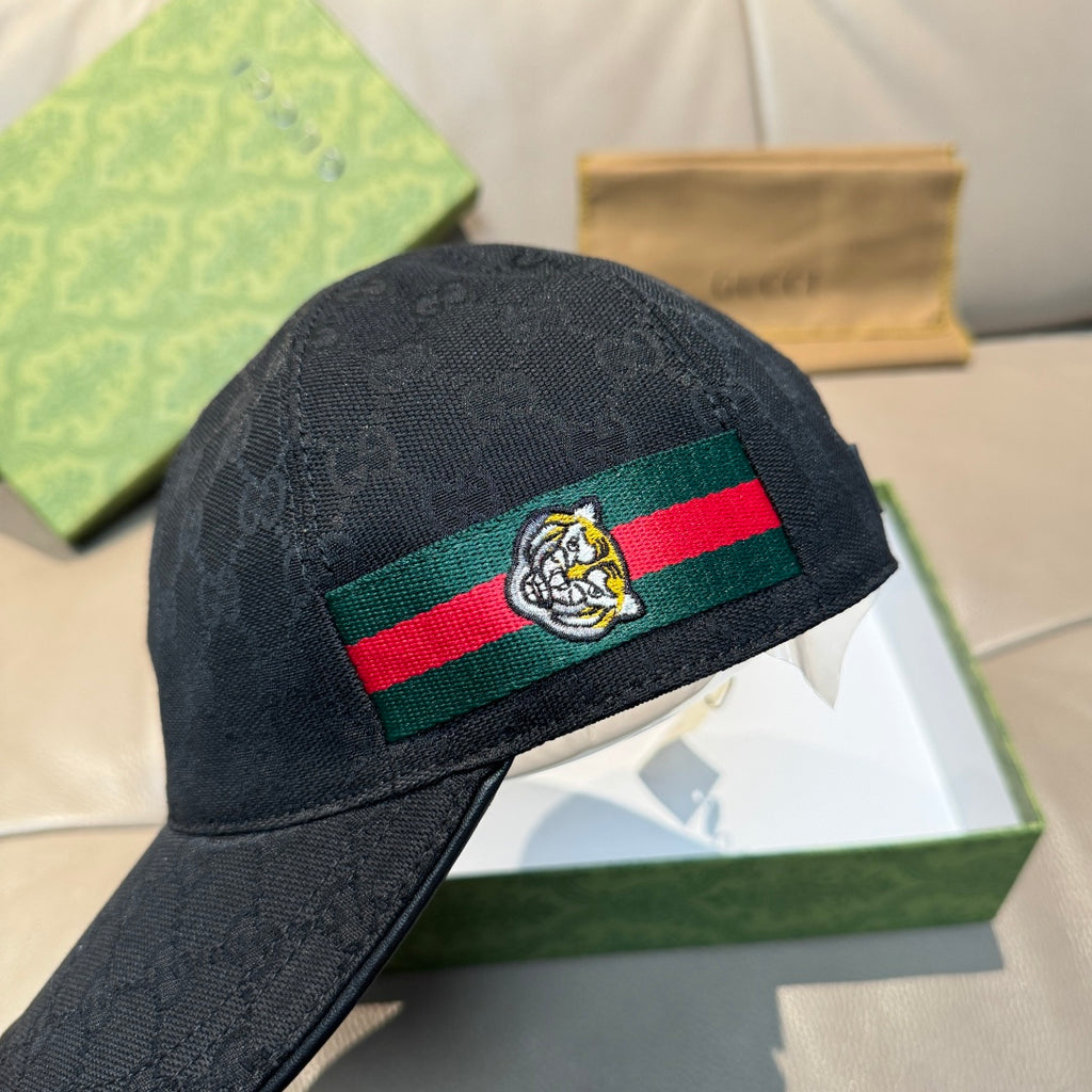 Gucci black baseball cap with Web stripe and bee crest, angled view