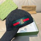 Gucci black baseball cap with Web stripe and bee crest, angled view
