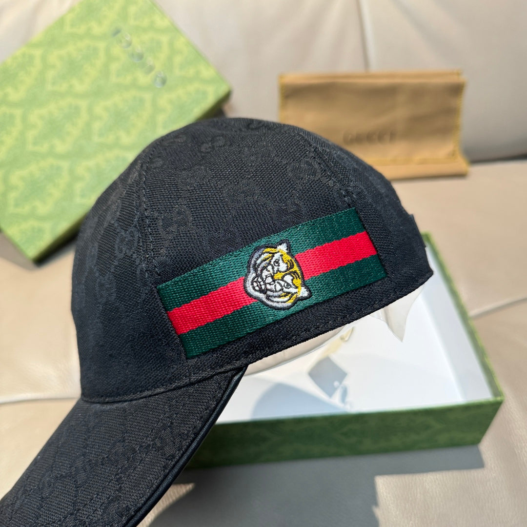 Gucci black baseball cap with Web stripe and bee crest, angled view