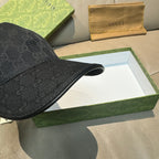 Gucci black logo baseball cap, side profile with curved brim