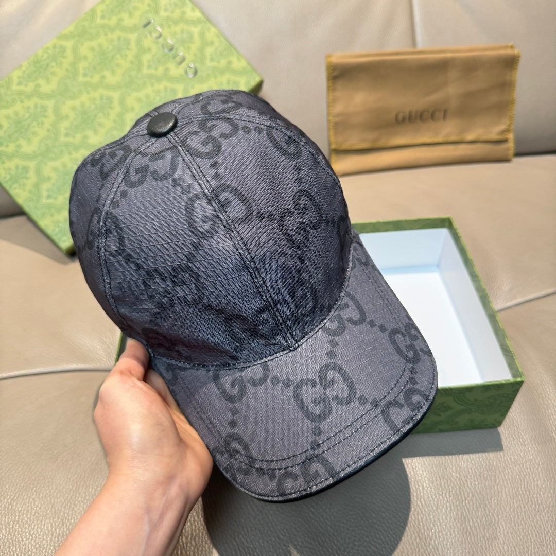 Gucci GG-pattern baseball cap, dark gray, shown in hand with front view