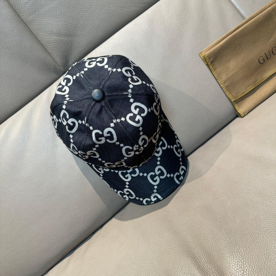 Gucci baseball cap in black with GG monogram pattern, top button, and curved brim