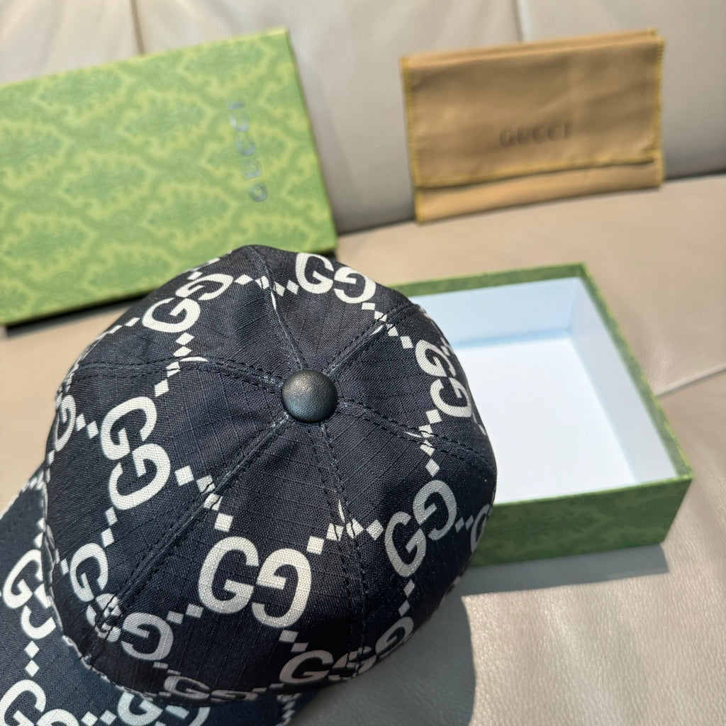 Gucci baseball cap close-up: black GG monogram fabric with round top button