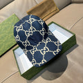 Navy denim baseball cap with allover white GG logo pattern and curved brim
