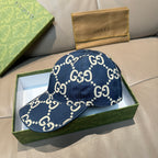 Navy denim baseball cap with white GG logo print, adjustable strap, and curved brim