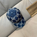 Navy denim baseball cap with small GG logo pattern, button top, and curved brim