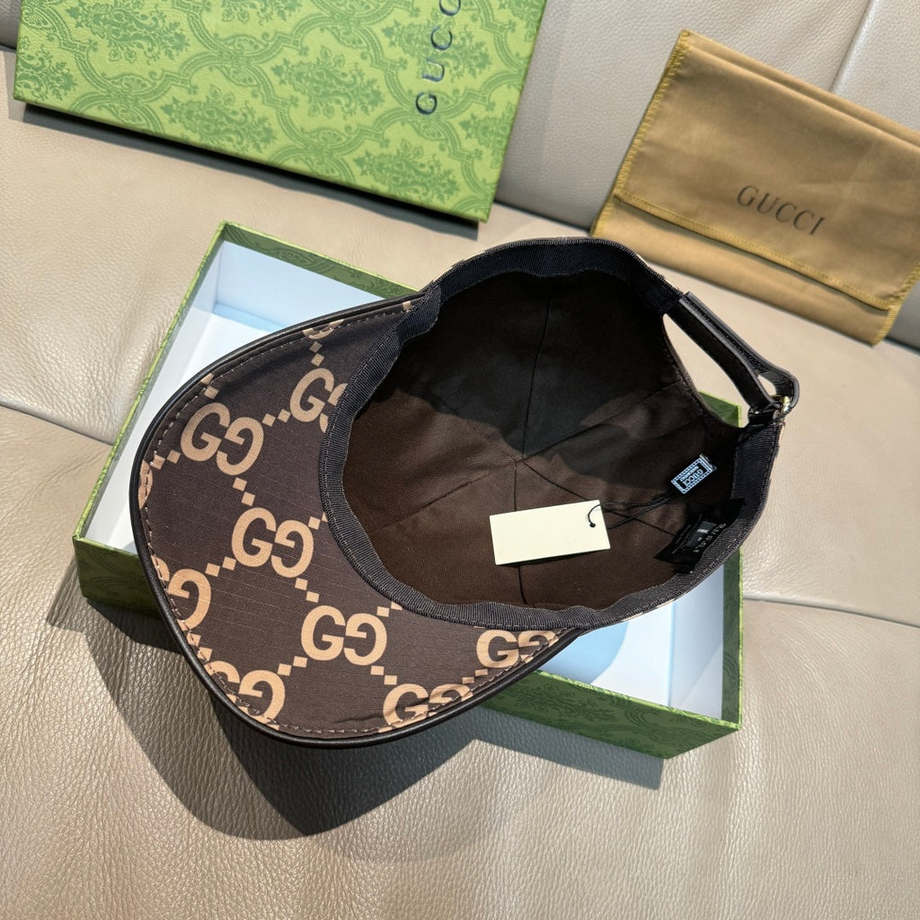 Gucci GG monogram cap with dark interior lining and brown/tan crown