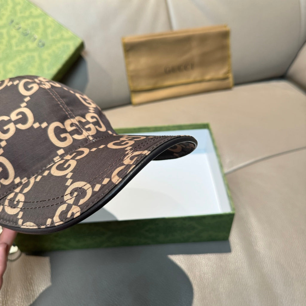 Gucci GG monogram baseball cap brim view, dark brown with tan G motif