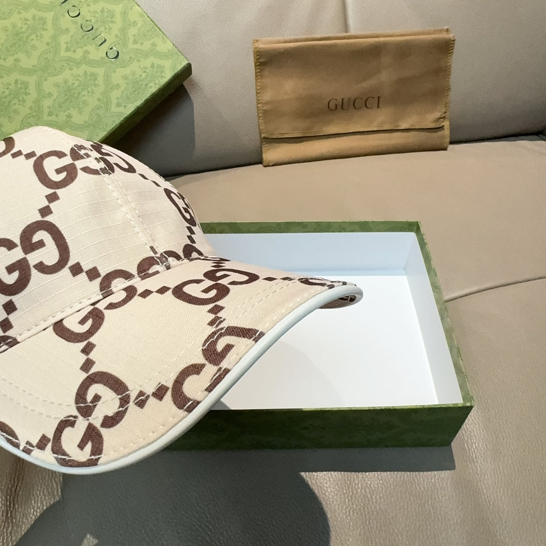 Gucci baseball cap side view with white GG monogram print and curved brim