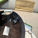 Gucci baseball cap with adjustable strap at back and GG monogram fabric