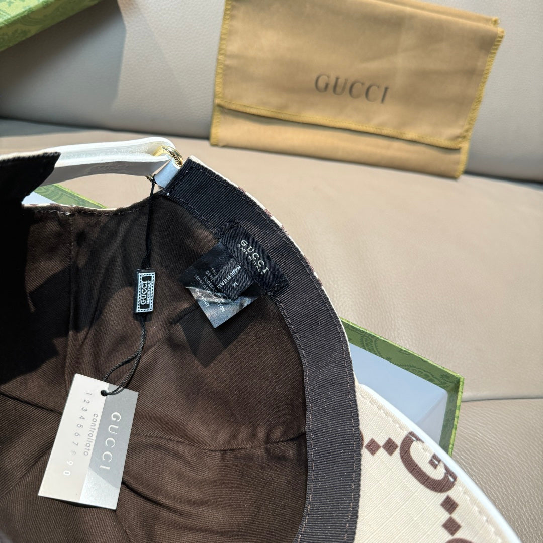 Gucci baseball cap with adjustable strap at back and GG monogram fabric