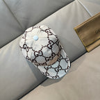 Gucci baseball cap with white GG monogram print and light blue top button