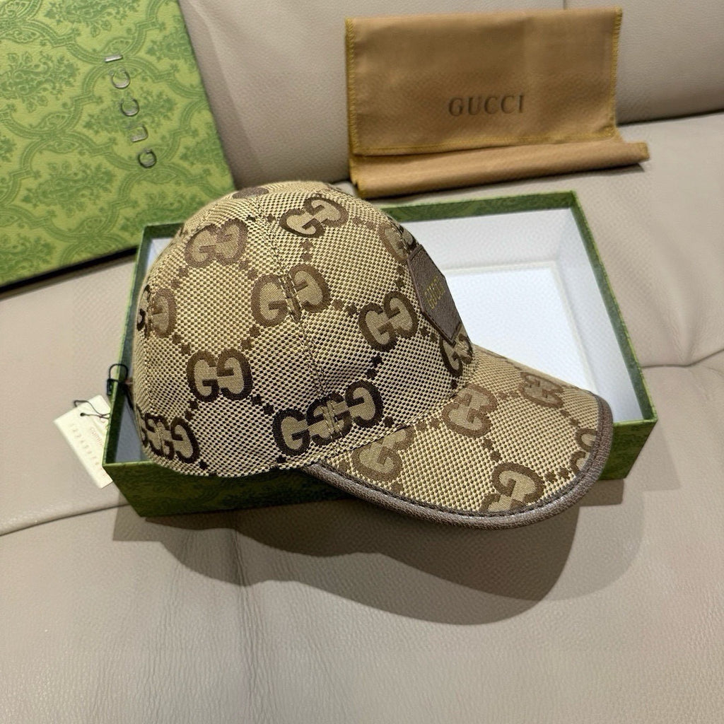 Gucci cap with beige GG monogram canvas, front profile view, curved brim.