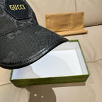 Black monogram baseball cap close-up of curved brim and top stitching
