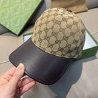 Beige GG monogram baseball cap with dark brim, front close-up
