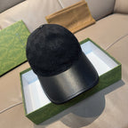 Black Gucci baseball cap with GG monogram print and curved brim