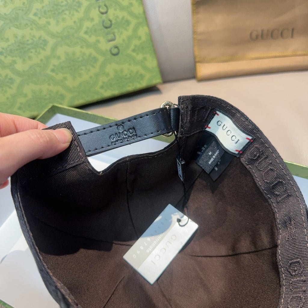 Black Gucci cap interior lining with tags and adjustable strap