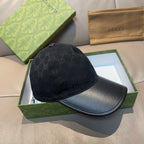 Black Gucci baseball cap with GG monogram crown and leather-look brim