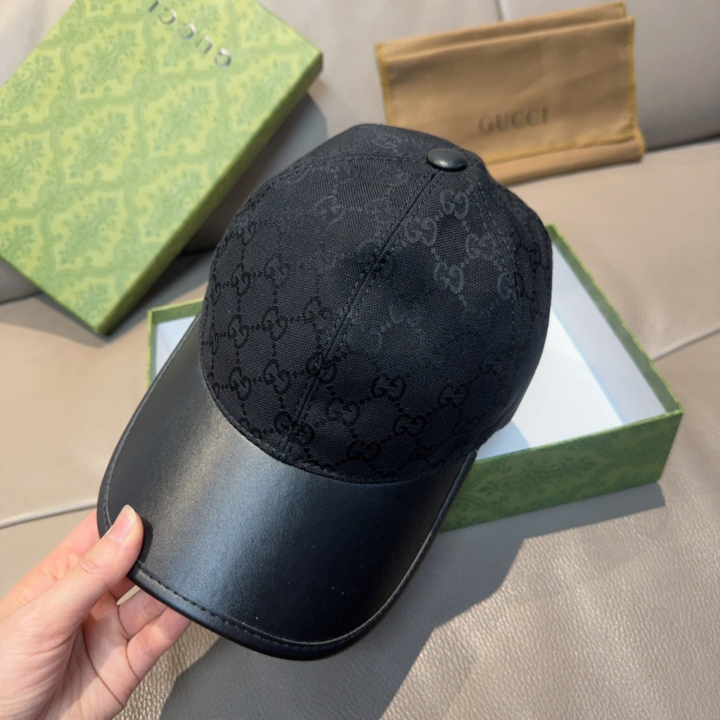 Black Gucci GG monogram cap with snap button detail and curved brim