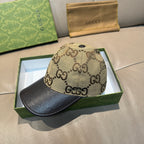 Gucci baseball cap with beige GG monogram crown and dark brim, angled view